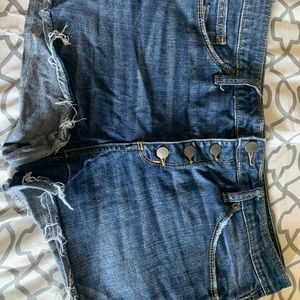Lightly destroyed low rise denim shorts